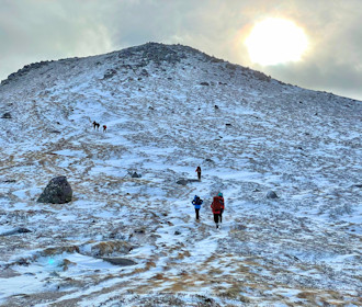 Hikers above the foot of Bynack More