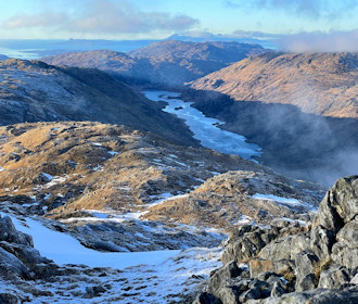 On Sgùrr an ùtha's summit looking out to Eigg and Rum